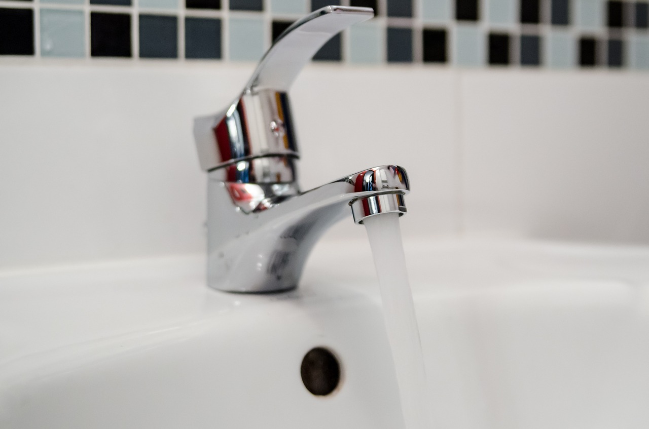 standing water article - image of running faucet